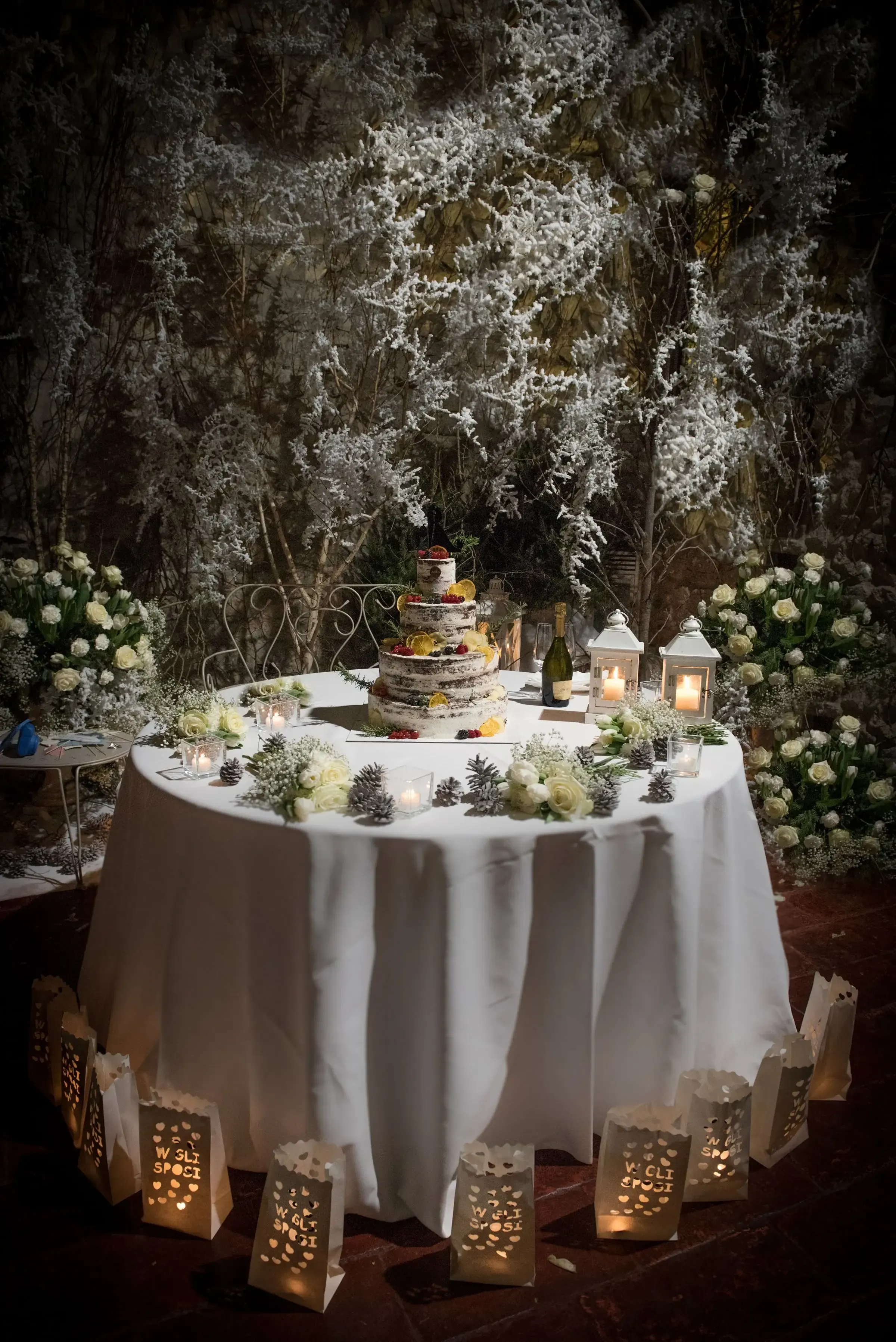 Winter wedding cake setup with elegant decor in Como, Italy.